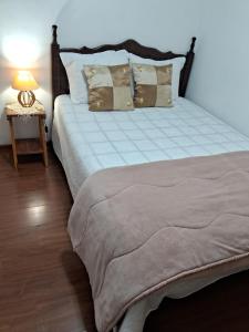 Ένα ή περισσότερα κρεβάτια σε δωμάτιο στο Dexa Hospedagem