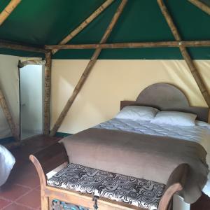 Postel nebo postele na pokoji v ubytování Glamping El Establo