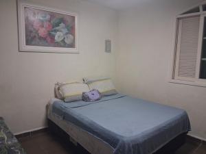 En eller flere senge i et værelse på Loft Praia do Sonho