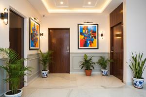 a hallway with potted plants in a building at Via Skyline I in Méribel Village