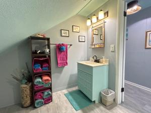 a bathroom with a sink and a vanity with a sink at Bayview #1 in Saint Ignace +40 photos