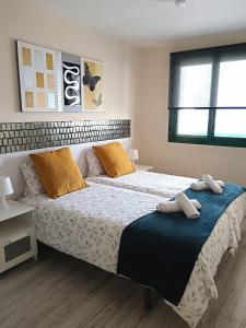 Ένα ή περισσότερα κρεβάτια σε δωμάτιο στο Panoramic view Puerto Rico