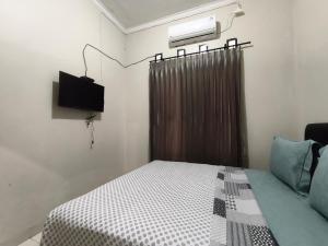 TV a/nebo společenská místnost v ubytování Loox Bale Ite Guesthouse