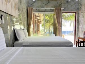 Postel nebo postele na pokoji v ubytování Nguyệt MInh 2 hotel Phan Thiet + 52 fotografií