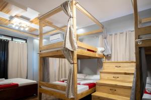 a bunk bed room with two bunk beds at RedDoorz at R2K Pension House in Puerto Princesa City