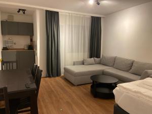 a living room with a couch and a table at Altstadt Kurzestr in Düsseldorf