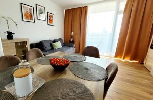 a living room with a table with chairs and a couch at 3-2-1 Zimmer Wohnungen in Mülheim an der Ruhr in Mülheim an der Ruhr
