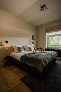 Voodi või voodid majutusasutuse Hoeve Hazegras toas