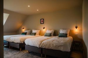 Voodi või voodid majutusasutuse Hoeve Hazegras toas +112 fotot