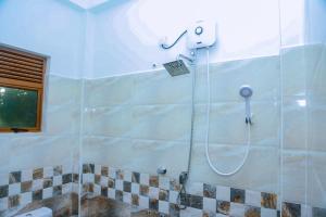 a shower with a shower head in a bathroom at Cozy 1BR Villa in Weligama Panoramic Sea View in Weligama +15 photos