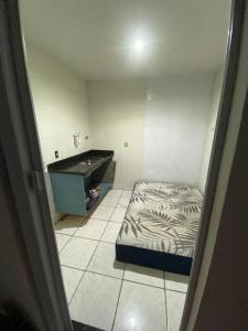 Ένα ή περισσότερα κρεβάτια σε δωμάτιο στο Estadia Urbana Júnior Gouvea