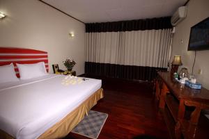 Katil atau katil-katil dalam bilik di Myanmar Life Hotel