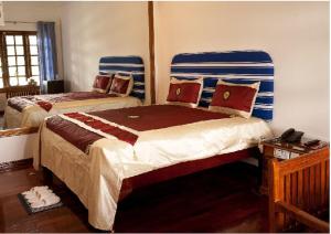 Katil atau katil-katil dalam bilik di Myanmar Life Hotel