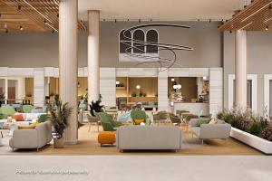 a lobby with couches and chairs in a building at Hotel Garden Istra Plava Laguna in Umag