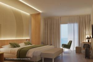 a bedroom with a bed and a chair and a window at Hotel Garden Istra Plava Laguna in Umag +21 photos