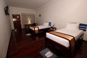 Katil atau katil-katil dalam bilik di Myanmar Life Hotel