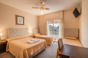 Ένα ή περισσότερα κρεβάτια σε δωμάτιο στο Hotel Marydor +17 φωτογραφίες