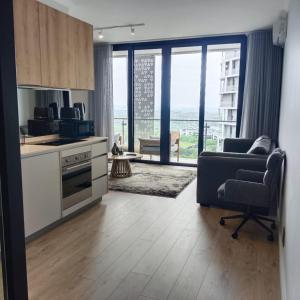 Et opholdsområde på Sunrise Waterfall at ELLIPSE