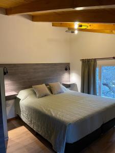 Ένα ή περισσότερα κρεβάτια σε δωμάτιο στο Apart Las Lilas