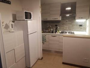 Køkken eller tekøkken på Casa vacanze ORCHIDEA BIANCA