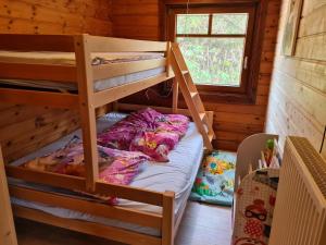 Ένα ή περισσότερα κρεβάτια σε δωμάτιο στο Das Haus Kaninchenhöhle