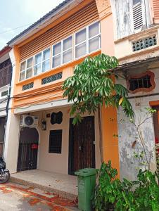 a building with a trash can in front of it at Senju Georgetown Heritage PrewarHouse 4BR 5-15 pax in George Town +68 photos