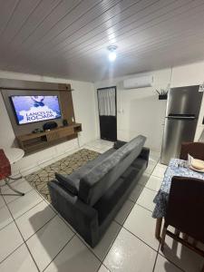 Телевизор и/или развлекательный центр в Casa Família Riese