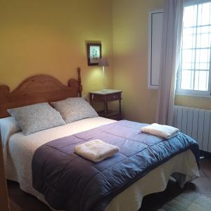 Postel nebo postele na pokoji v ubytování Casa rural La Vega