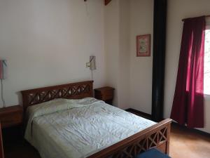 a bedroom with a bed in a room at La casa de los Abuelos in Costa del Este