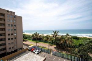 a view of the beach from a building at Beach Retreat in Amanzimtoti