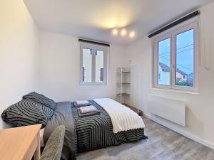 Un pat sau paturi într-o cameră la Illkirch-issime - Neuf - Tram - Proche centre-ville - Moderne