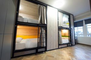 a room with two bunk beds in it at Revolver Edinburgh in Edinburgh