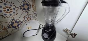 a blender sitting on top of a counter at Apartamento Barra Vento 2 in Guriri