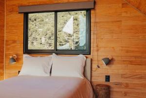 Ένα ή περισσότερα κρεβάτια σε δωμάτιο στο Refúgio da moeda 2