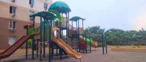a playground with a slide in a park at Oshanbyu Transient Home in Basbas