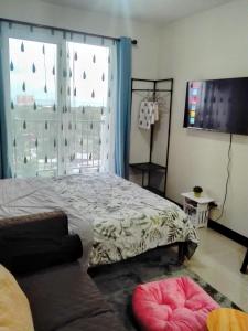 Ένα ή περισσότερα κρεβάτια σε δωμάτιο στο Oshanbyu Transient Home +16 φωτογραφίες