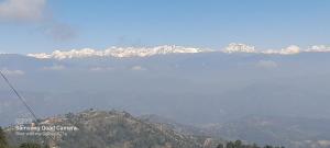 a view of a mountain range with snow covered mountains at Saura Point Homestay in Nagarkot