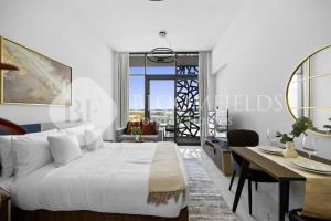 En eller flere senge i et værelse på Bloomfields Deluxe STU The Gate Masdar City