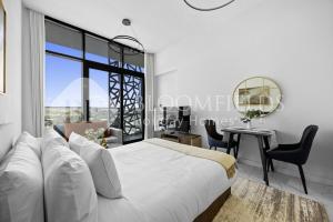 En eller flere senge i et værelse på Bloomfields Deluxe STU The Gate Masdar City