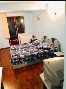 Postel nebo postele na pokoji v ubytování Pensiunea La Gheorghiță Fundata