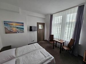 Ένα ή περισσότερα κρεβάτια σε δωμάτιο στο Zefir Węglarz