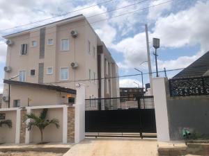 a building with a gate in front of it at LinQues & Bethel Residences in Ibadan