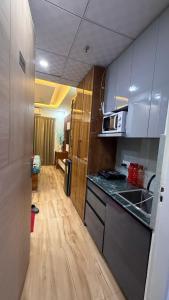 a small kitchen with a sink and a counter top at The noida heaven in Greater Noida
