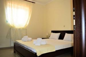 En eller flere senge i et værelse på Villa AlexandraSea View