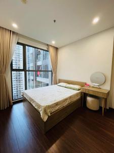 Giường trong phòng chung tại Sora House 10 - Vinhomes Ocean Park