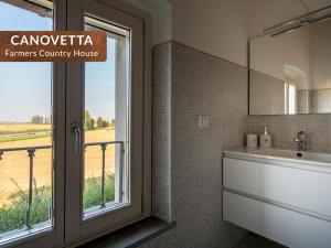 a bathroom with a sink and a window at Canovetta Country Houses - nearby Cremona in Dosimo +52 photos