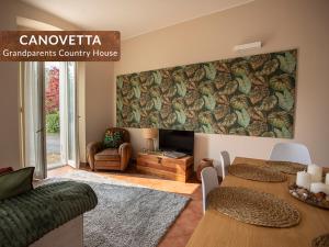 a living room with a table and a fireplace at Canovetta Country Houses - nearby Cremona in Dosimo