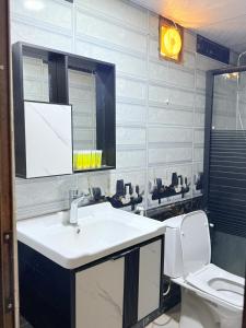 a bathroom with a sink and a toilet at Omar wadi rum camp in Wadi Rum +50 photos