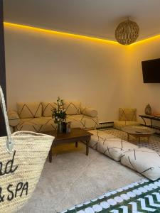 a living room with a couch and a table at RIAD KS & SPA in Marrakesh