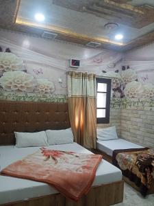 Ένα ή περισσότερα κρεβάτια σε δωμάτιο στο Jindal homestay